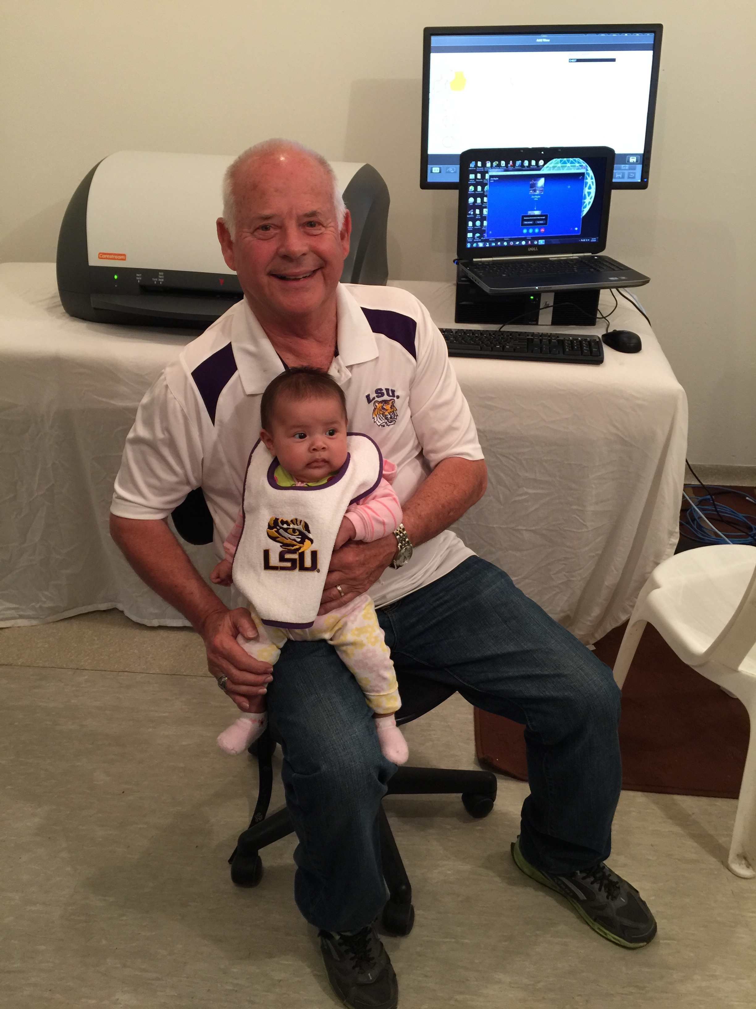 The youngest LSU fan sitting in front of the new digital x-ray setup.